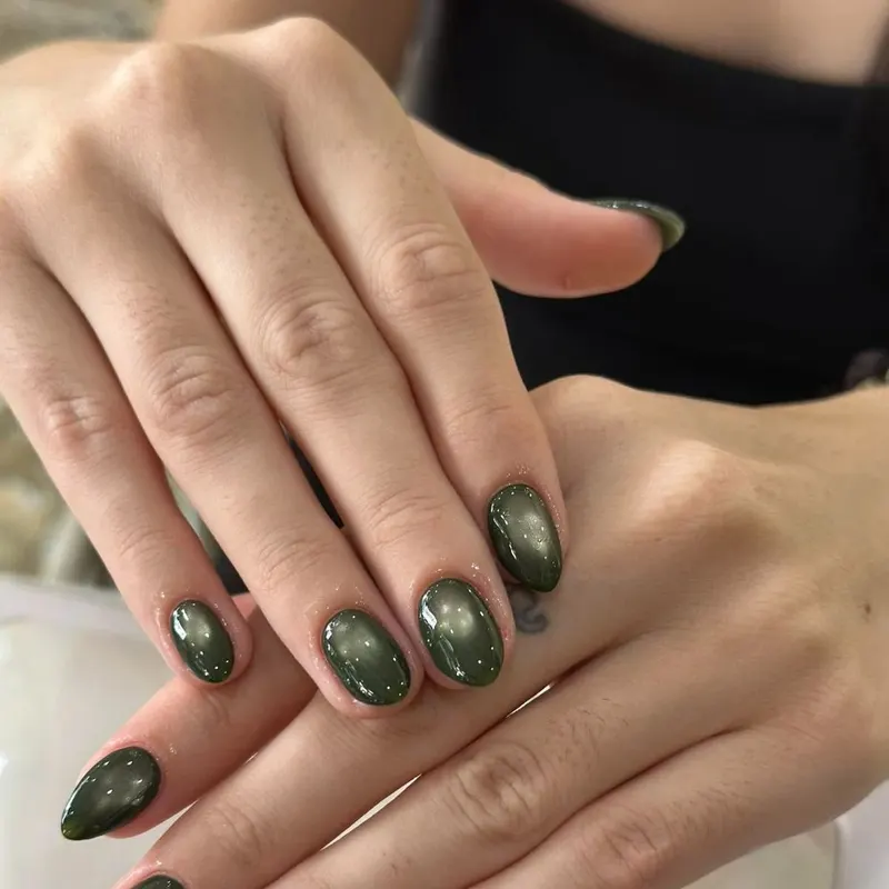 LENA Nails & Beauty Da Nang — Dark Green Cat Eye Almond Nails